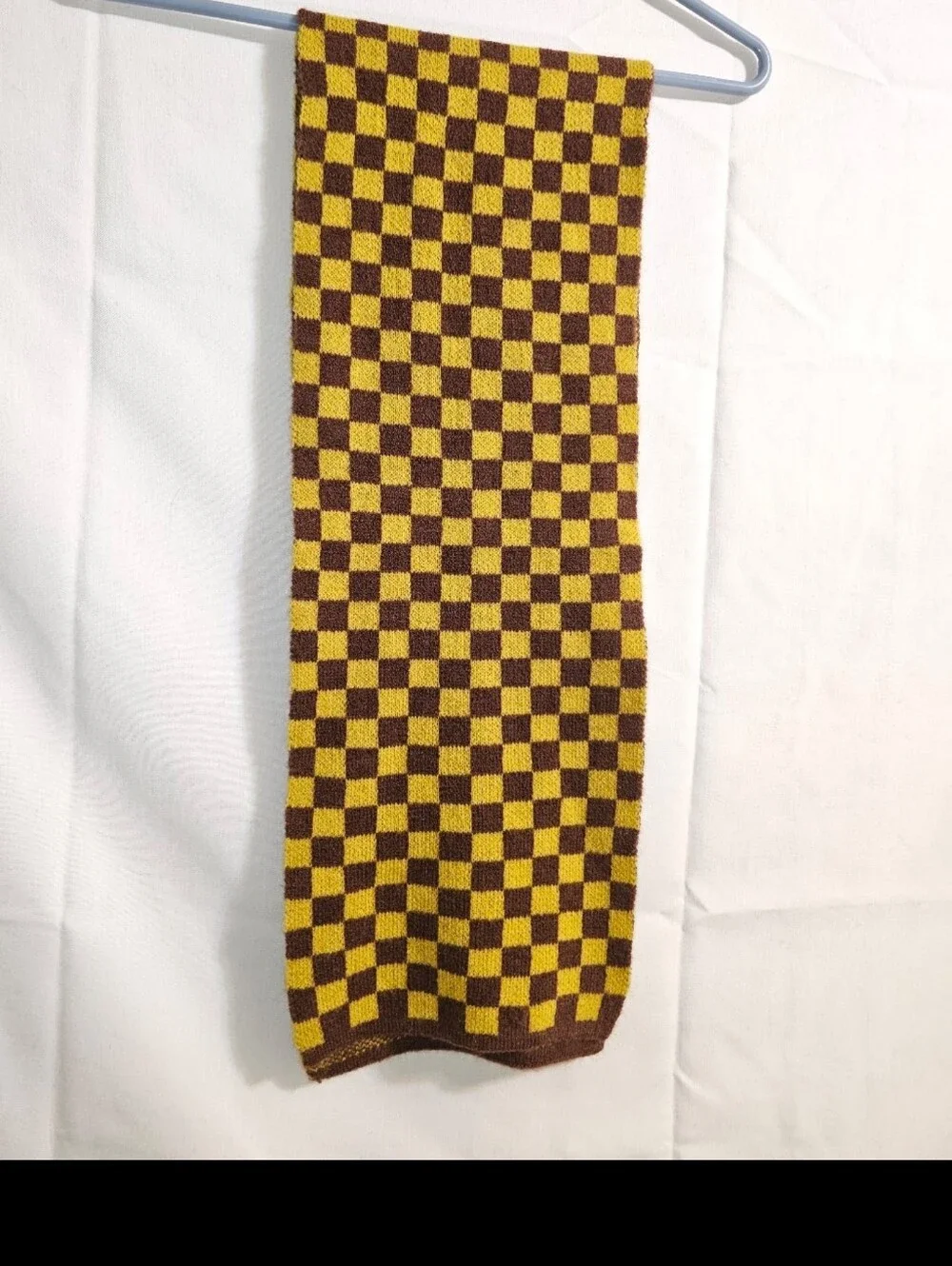 soft knit scarf  brown and mustard yellow checkerboard pattern.
